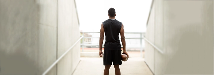 Chiropractic San Francisco CA Football Player A football player holding a ball.