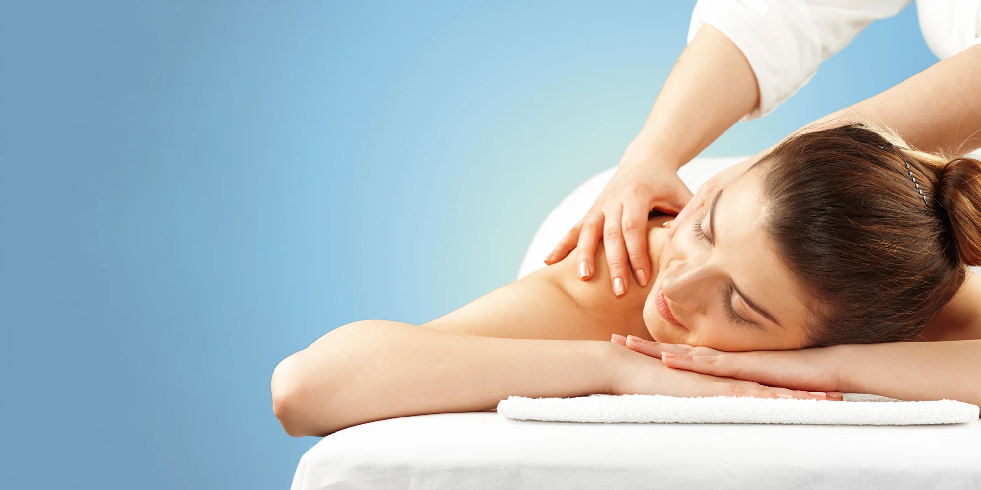 A person receiving a back massage.
